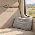 Carbon Air Pillow. Press-to-inflate travel pillow that folds small