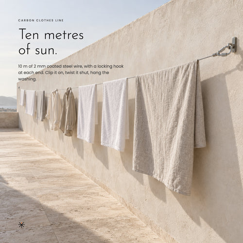 Carbon Clothes Line strung along a terrace wall with laundry