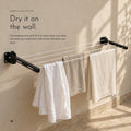 Carbon Clothesline. Wall arms that fold flat, 55 ft of nylon rope