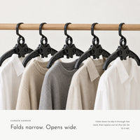 Carbon Hanger. Folds narrow to slip in through the neck. view 1